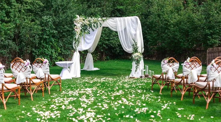 Create a beautiful outdoor wedding in Coimbatore with green landscape and beautiful settings.